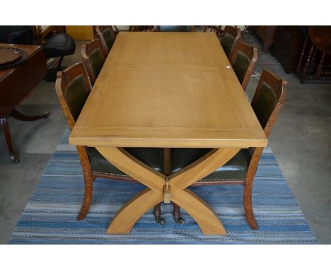 A modern light oak dining table on cross frame stretcher, 180 cm long, 89 cm wide