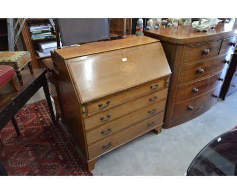 An Edwardian mahogany and satin inlaid bureau with fall-front panel enclosing a fitted interior and four long graduating draw