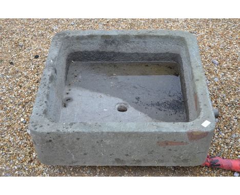 A large hollowed stone square garden sink or planter, 76 cm