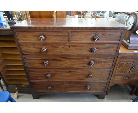 A large Victorian mahogany chest of two short over four long graduating drawers with turned mother of pearl inset handles, ra