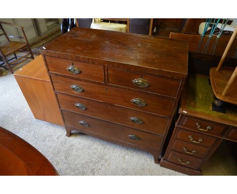 A George III mahogany chest of two short over three long drawers with floral brass handles and splayed bracket feet, 100 cm w