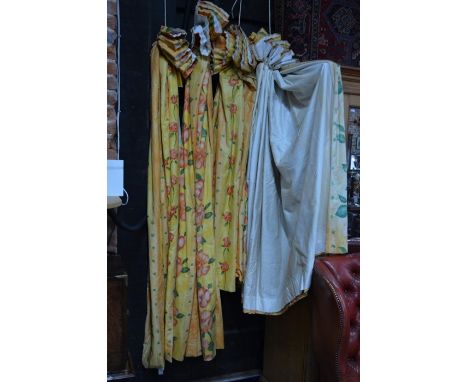 Two pairs of thermal lined curtains in yellow and orange floral design, one pair width 187 cm, drop 203 cm; the other pair wi