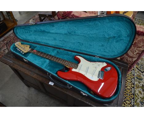 Fender Squier Strat red electric guitar (CY9914032) with fitted hard case to/w Wittner metronome, spare strap, various wallha