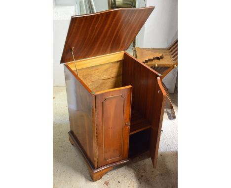 A small yew wood crossbanded side cabinet, Serpentine front with two panelled doors, raised on bracket feet