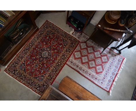 Indo-Persian Turkoman design rug, repeating diamond design on red ground within light blue and ivory borders 146 cm x 98 cm t