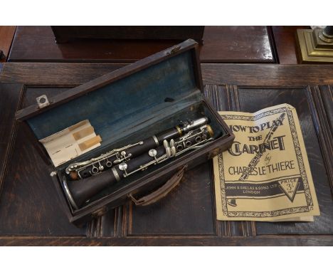 A vintage cased clarinet, with instructions and spare reeds, a/f