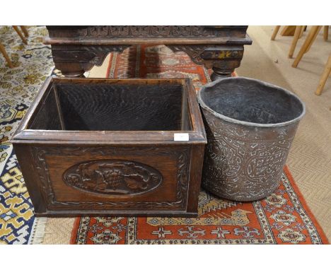A 19th century oak planter of rectangular form carved with foliate, grape and vine decoration to/w antique Middle Eastern cop