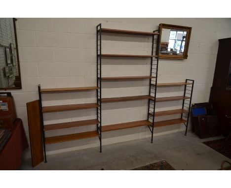 A 1960s/70s modular teak Ladderax wall unit with four ladder style upright supports and fourteen adjustable shelves&nbsp;