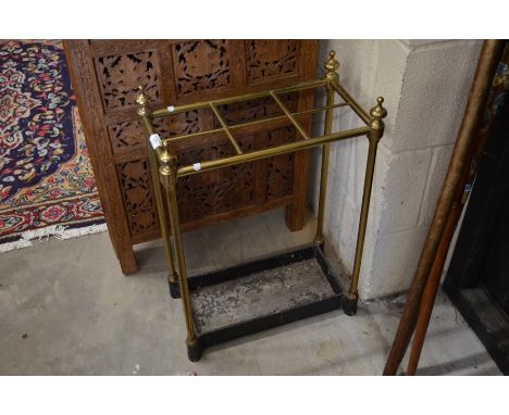 A brass and cast iron six division stick stand