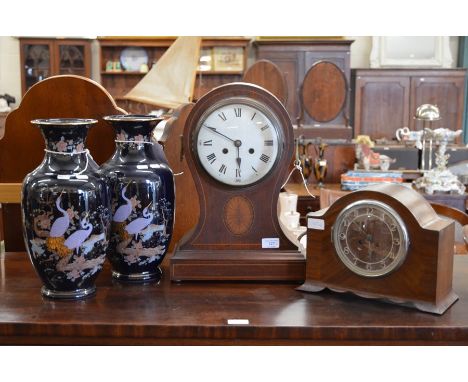 A pair of porcelain baluster vases, navy ground decorated with Asiatic pheasants on a flowering branch, a/f, 36 cm high to/w 