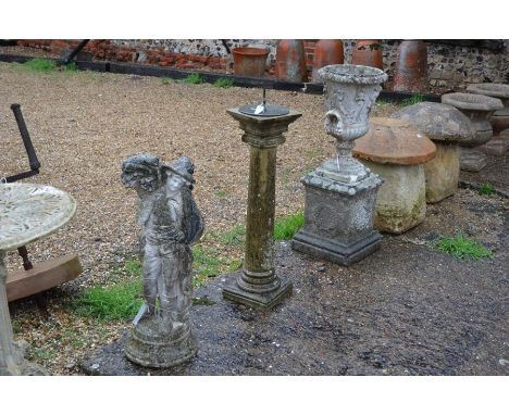 A weathered stone garden urn on square plinth to/w a weathered stone column sundial and a weathered cast stone figure (3)