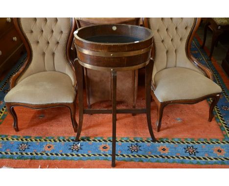 'R. A. Lister &amp; Co' coopered oak and copper bound oval planter with metal liner shaped supports and cross stretchers