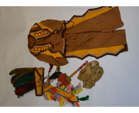 A collection of vintage children's fancy dress costumes including a large and smaller native American costumes, a Tyrolean se