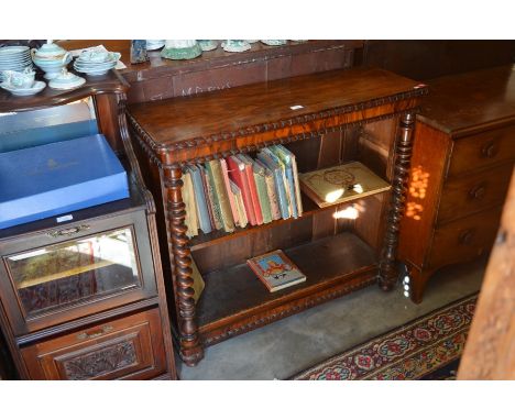 A Victorian rosewood open bookcase with single adjustable shelf, with beaded mouldings and barley twist column supports, 101 