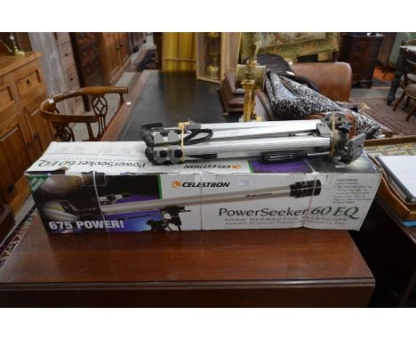 A Celestron Power Seeker 60EQ 60mm refractor telescope (box) c/w associated tripod, and a collection of camera equipment incl