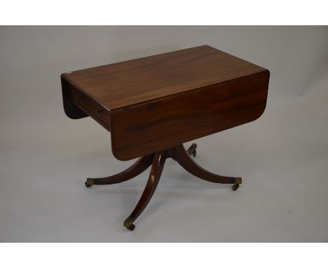 &nbsp;A 19th century mahogany sofa table, the drop leaf top with end drawer raised on turned column and quad supports and cas