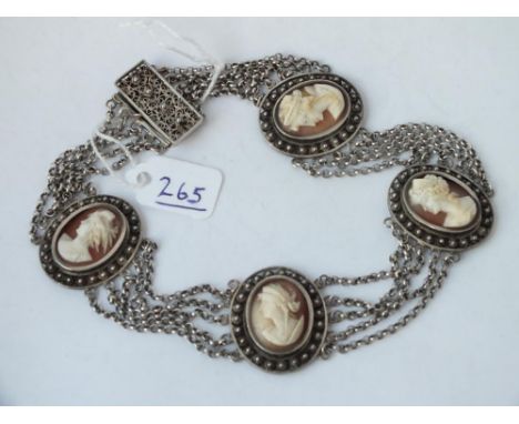 A silver mounted necklace with four carved cameo panels of ladies heads        
