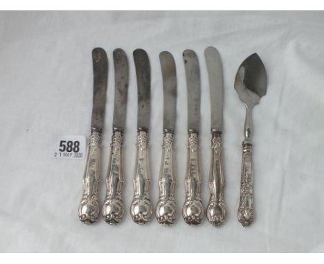 Six silver handles tea knives and a mounted jam spoon   