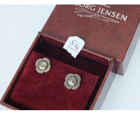 A pair of George Jensen silver ear studs with flower heads in   original box        