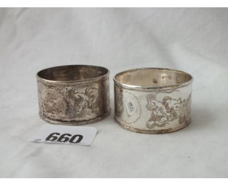 A pair of Chinese silver napkin rings engraved with a dragon marked  silver         