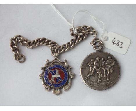 Two football silver medals on a chain      