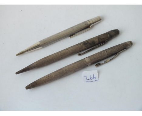 Three silver pencils       