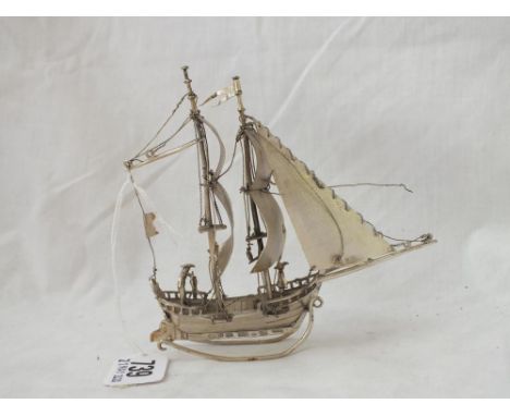 A small Dutch silver galleon with two masks, import marks, 5” high 