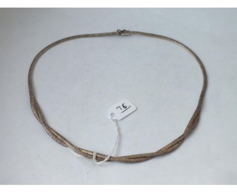 A silver necklace with frosted finish     