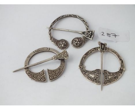 Three silver tara brooches      