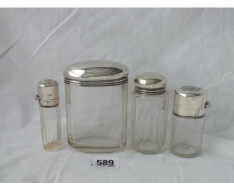 Four various silver top jars      