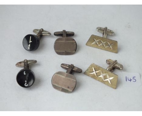 Three pairs of silver mounted cuff links     
