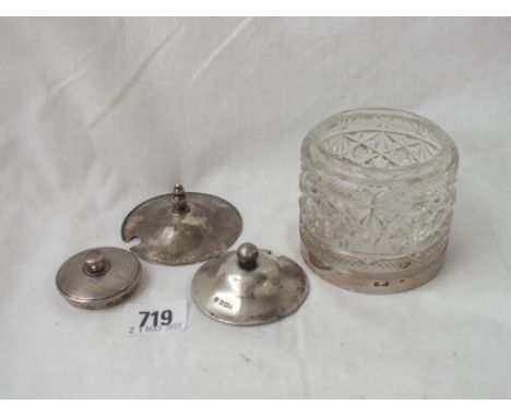 A silver mounted jar with glass body and three covers   