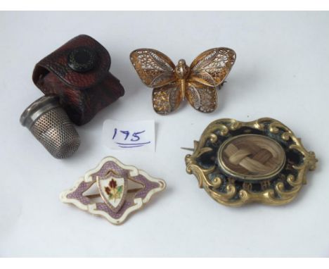 A silver gilt and enamel brooch, a silver thimble in case and two other brooches        