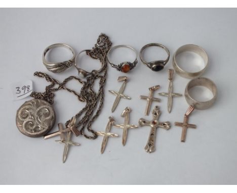 Six silver rings, crosses etc      