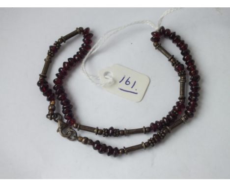 A silver and garnet bead necklace     
