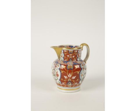 A WORCESTER PORCELAIN JUG with polychrome painted oriental style decoration on a red and gilt ground, c.1810, 5.5" high