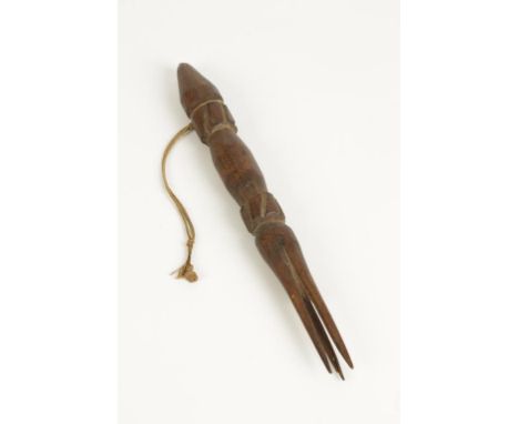 A CARVED WOOD CANNIBAL FORK with three prongs, probably 19th century, 11.5"