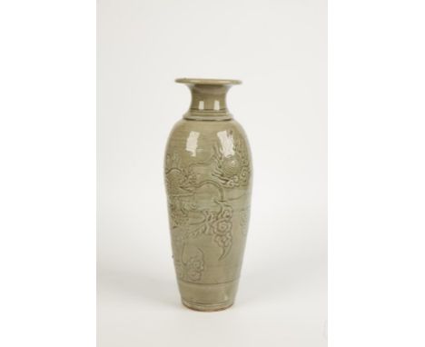 A CHINESE CELADON VASE of tapered shape, carved and incised with a dragon pursuing the flaming pearl amongst clouds, 20th cen