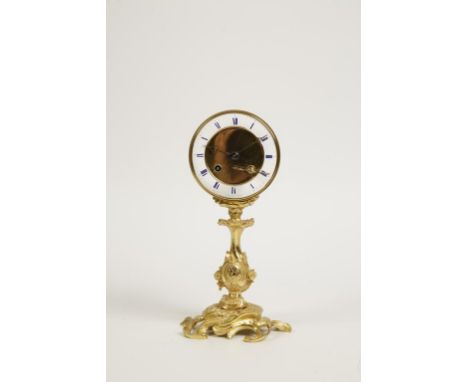 A GILT METAL CASED DRUM CLOCK, the white enamel dial mounted in a gilt metal drum with eight day "Japy" type movement strikin