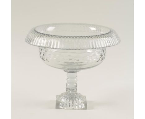 AN IRISH CLEAR GLASS BOWL with a "turn over" cut rim, on a tapering stem and square "lemon squeezer" foot, 19th century, 10.5