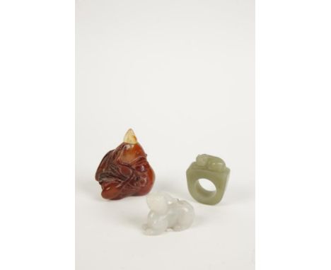 A CHINESE JADE "ARCHERS" RING, an agate snuff bottle and another item (3)