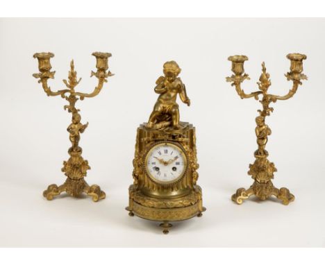 A 19TH CENTURY FRENCH GILT METAL CLOCK GARNITURE, the clock with enamel dial signed "Gasnier, Paris", with a two train moveme
