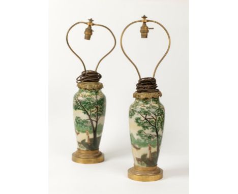 GAUTHIER: A PAIR OF ART NOUVEAU PAINTED AND ETCHED VASES decorated with scenes of a figure rowing in a lake, with trees to th