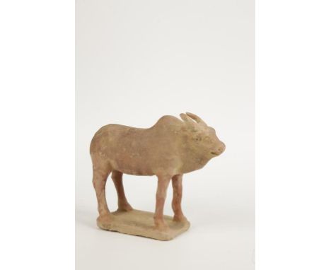 A CHINESE POTTERY MODEL OF A ZEBU OX standing, 20cm high, together with "The Asian Ceramic & Art Association The Macao Archae