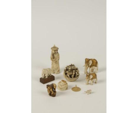 A GROUP OF CHINESE, JAPANESE AND INDIAN SMALL DECORATIVE IVORIES, circa 1890-1920, including a standing figure of a Chinese m