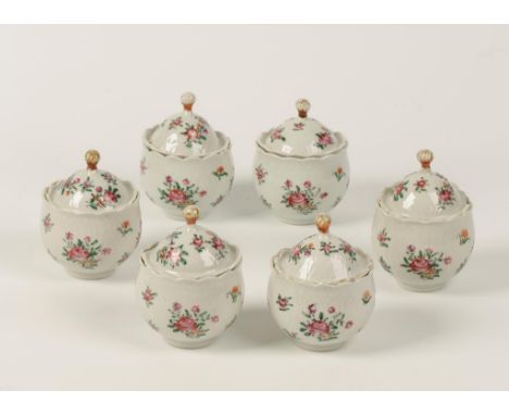 A SET OF SIX CHINESE EXPORT FAMILLE ROSE PORCELAIN CUSTARD CUPS AND COVERS, each with domed and scale incised cover with knot