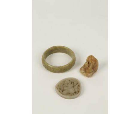 A CHINESE JADE PEACH FORM SMALL PLAQUE, late Ming style, pierced and carved with a kylin amongst clouds, 5.7cm; a jade type s