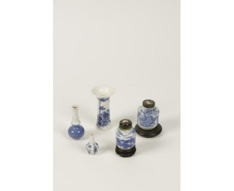 A CHINESE BLUE AND WHITE PORCELAIN SNUFF BOTTLE painted with warriors amongst waves and clouds, with horn stopper, on wooden 