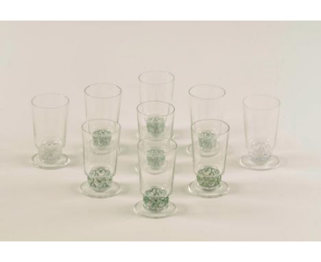 LALIQUE: A SET OF NINE LALIQUE SHOT GLASSES with straight sided bowls, on short stems moulded with birds, on spreading feet, 