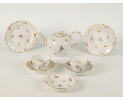 A MEISSEN PORCELAIN PART TEA SET painted in polychrome with floral decoration and gilt line rims. Comprising teapot, two cups